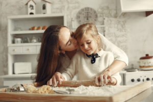 Family in a kitchen. Beautiful mother with little daughter.