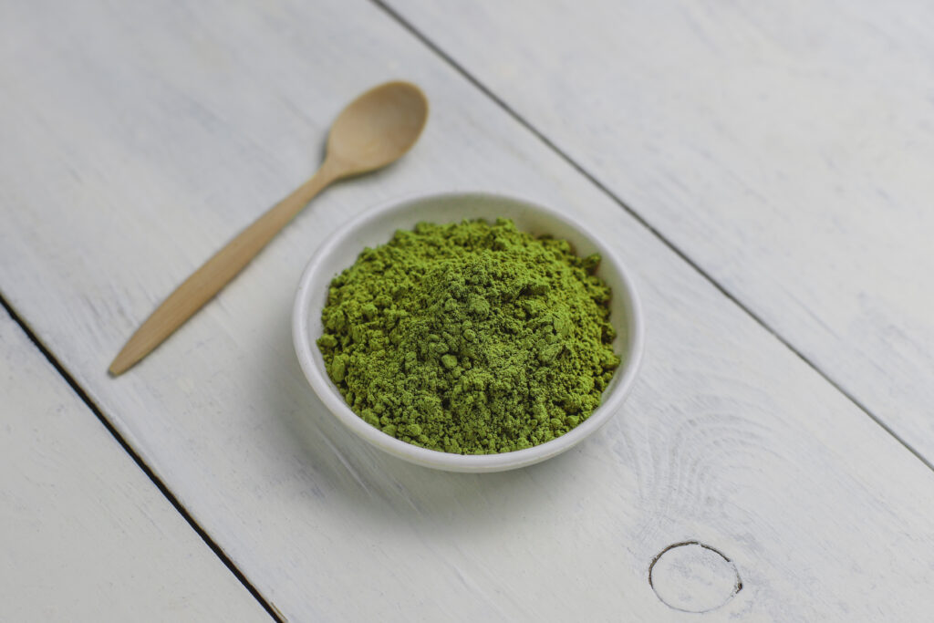 Word matcha made of powdered matcha green tea and bamboo spoon o